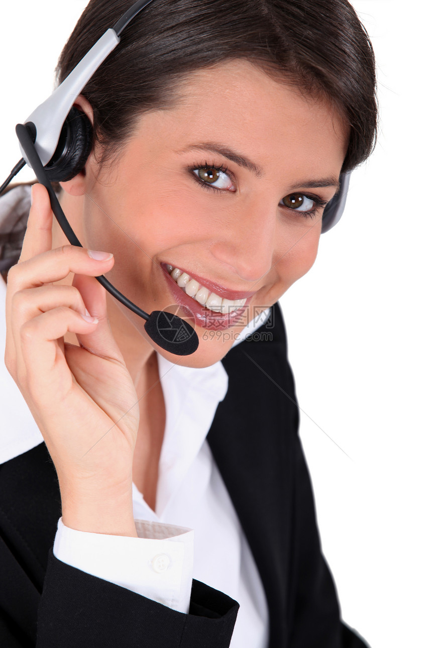 手戴耳盔的笑女人麦克风推销听筒成人顾问服务推销员客户办公室职业图片