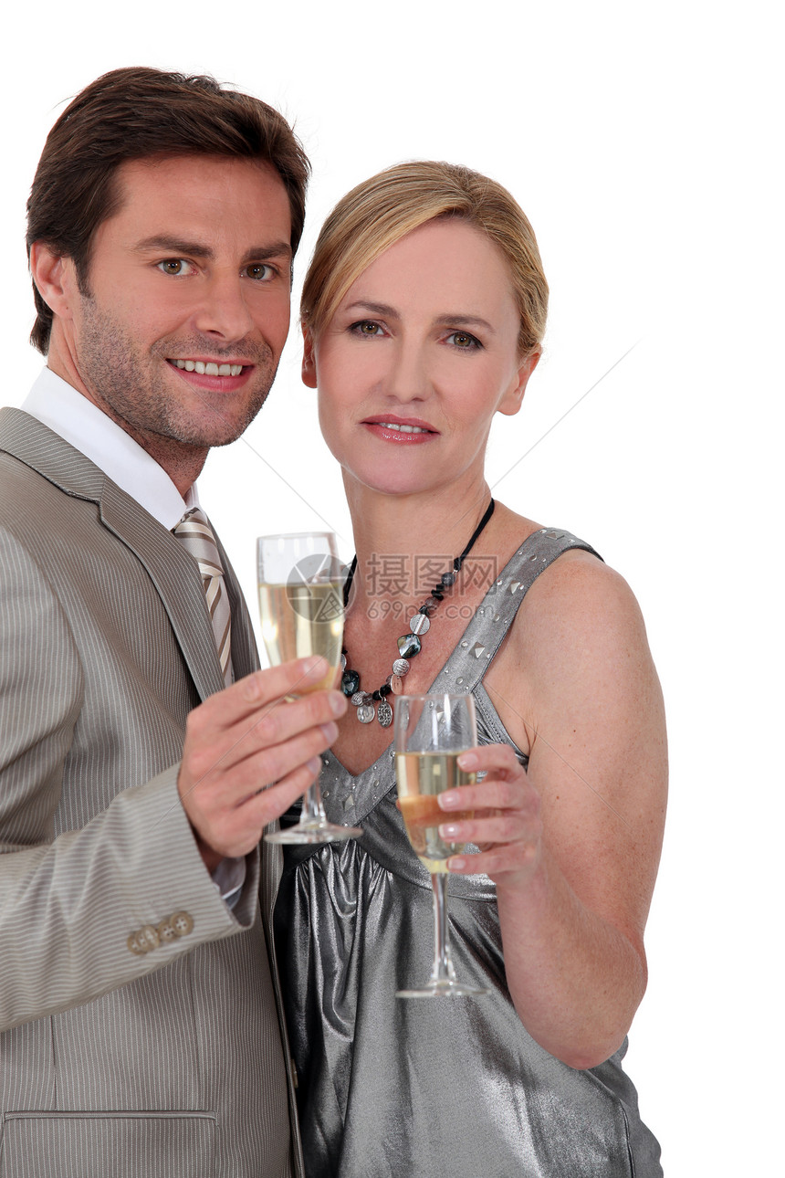 一对夫妇喝香槟 鸡尾酒礼服女士男性食物女性男人眼镜闲暇商业庆典同事图片