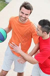 篮球运动员发射教学男性篮球衫衣服橙子宣传女孩推广运动背景图片