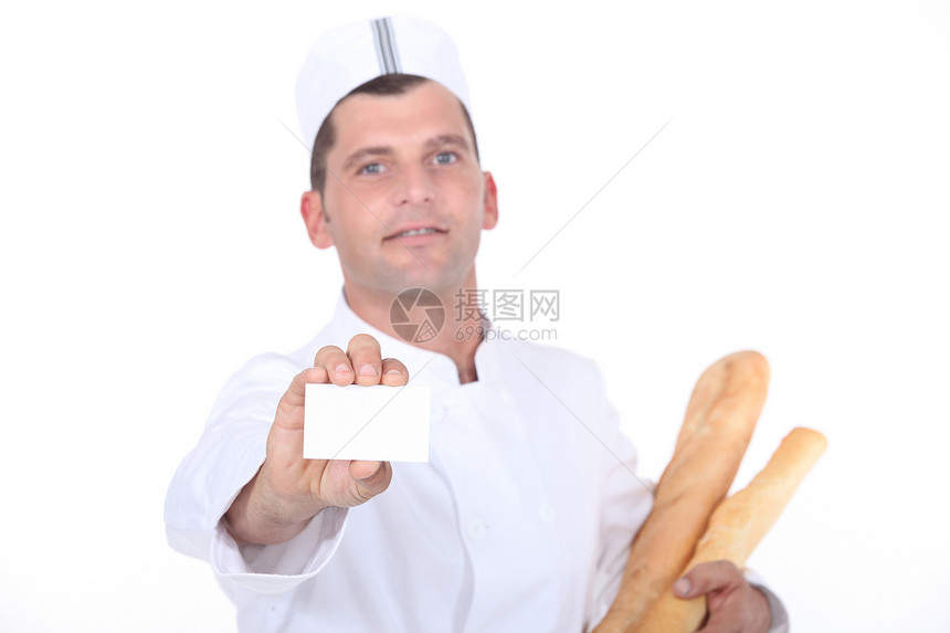 持有空白商业名片的面包工人图片
