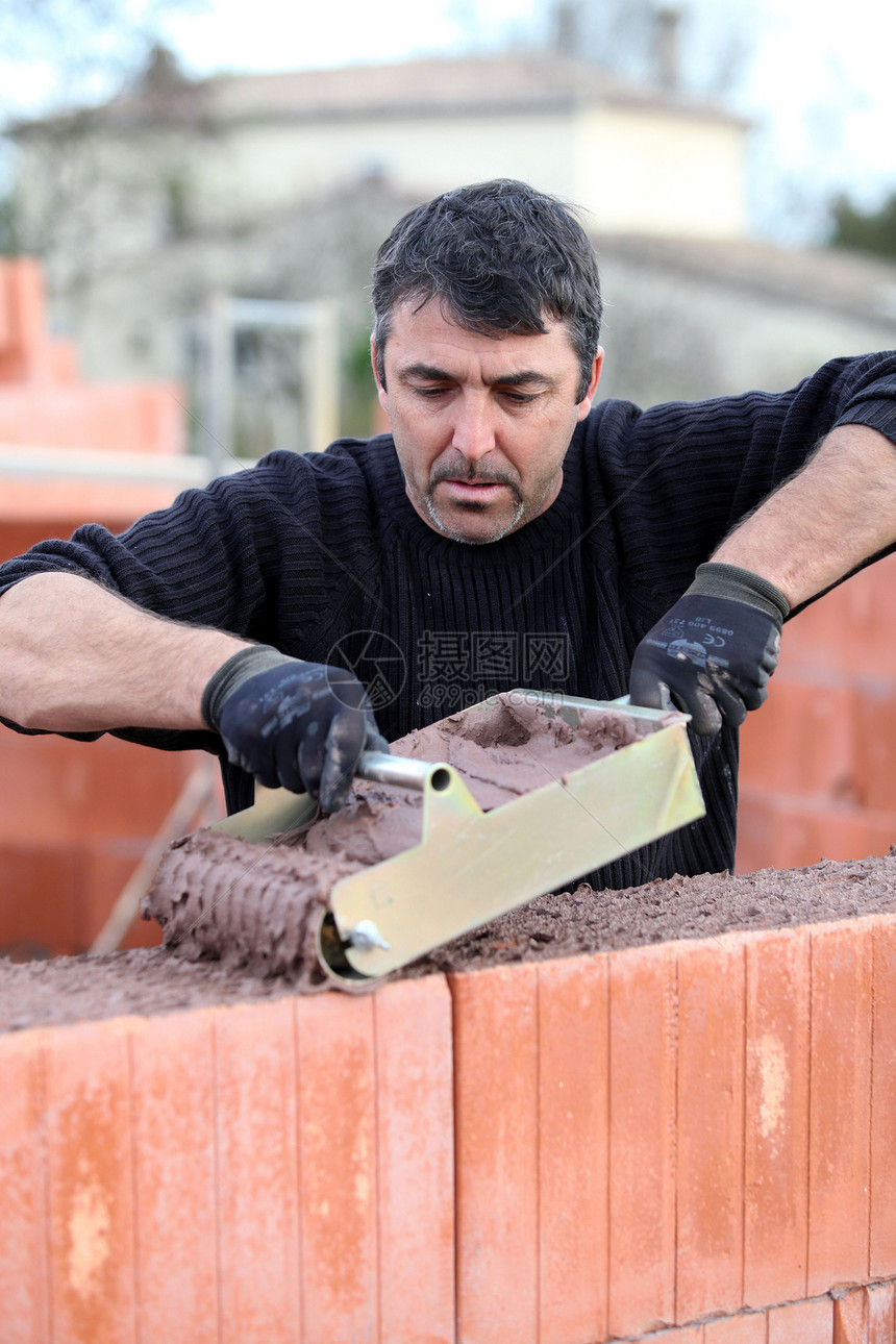 Bricklayer 盖一栋房子建筑瓦工男性结构水泥蓝领石工工具男人房地产图片