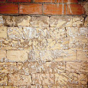 修复砖墙的废碎砖墙建筑石膏水泥拼装风化接缝工作乡村房子衰变背景图片