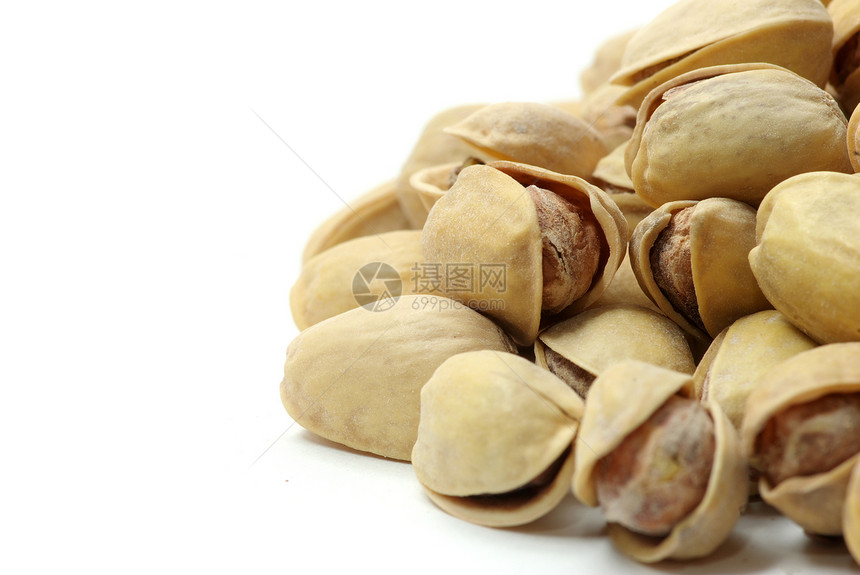 Pistachios 螺旋藻健康坚果核桃花生种子小吃植物市场核心开心果图片