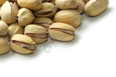 Pistachios 螺旋藻核心开心果小吃核桃市场坚果植物健康种子花生背景图片