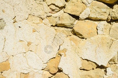 旧墙墙风化古铜色石头画幅水平土坯黏土背景图片
