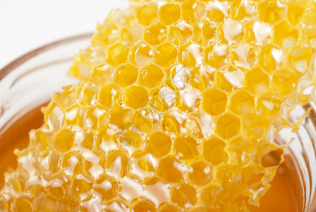 罐有机蜂蜜液体治愈产品反射玻璃食物营养用具花蜜甜点背景图片