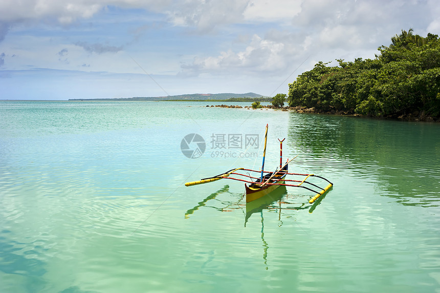 传统的菲律宾船印花布情调文化海岸线假期木头运输异国天空蓝色图片