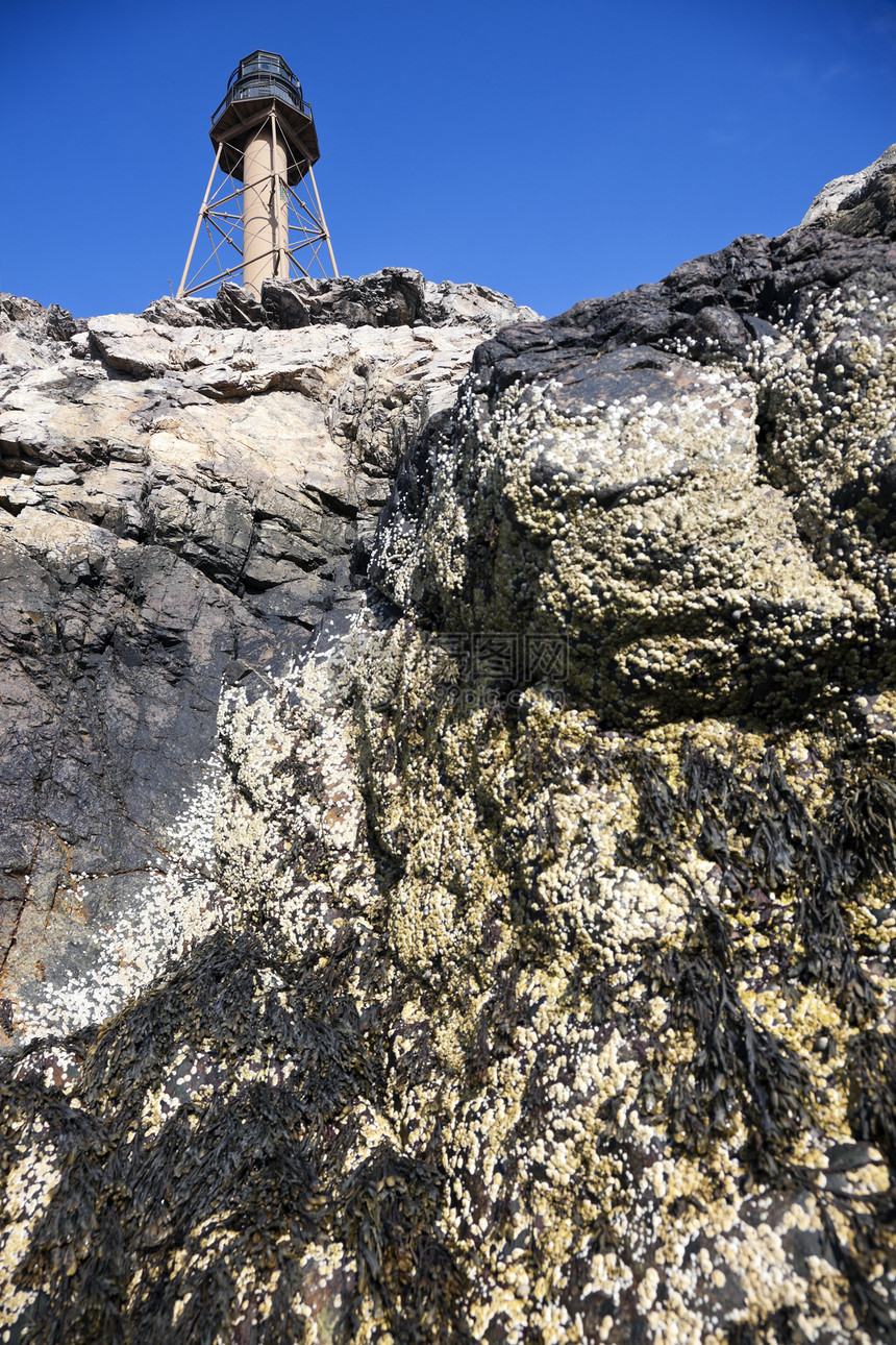 Marblehead 灯塔悬崖蓝色建筑学旅行天空运输地标岩石大理石头棕色图片