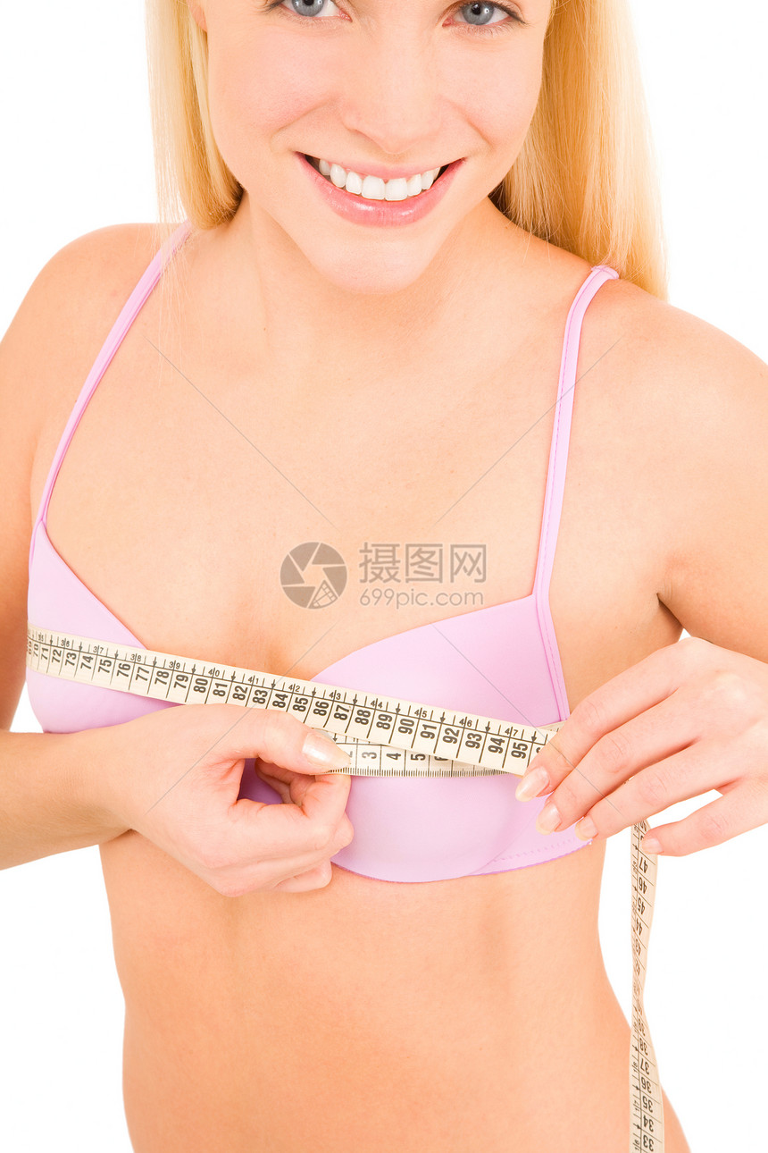 女人用胶带测量她的乳房胸部微笑金发女郎卷尺女子乳罩内衣长发美丽金发图片