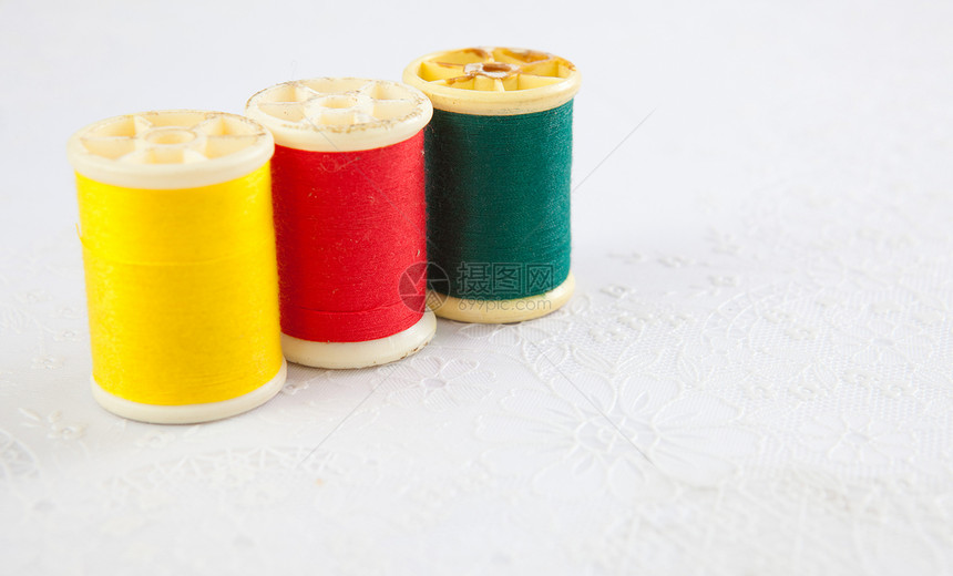 红黄绿色绿线维修团体织物裁缝缝纫黄色工作纺织品棉布针线活图片