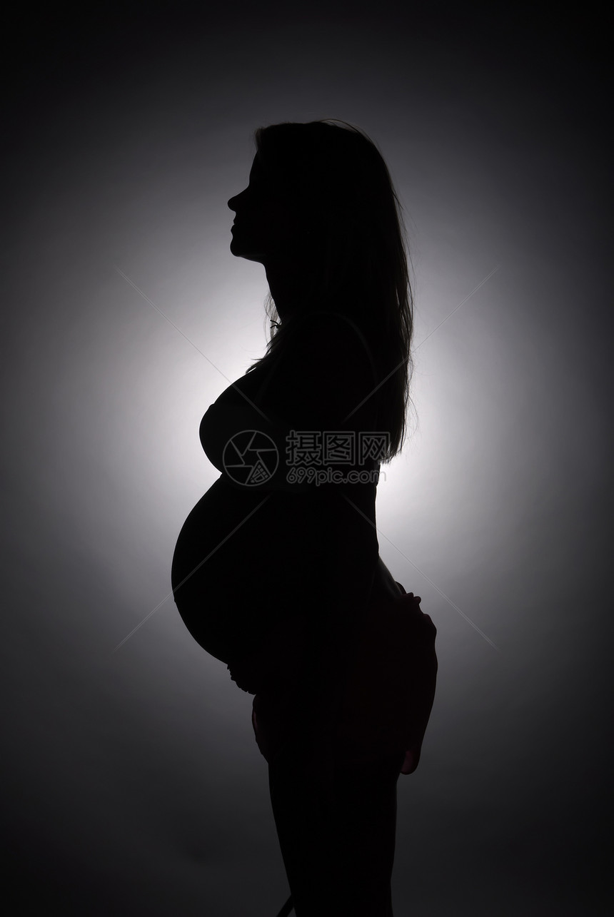 孕妇的肖像黑色女士家长影棚新生活肚子女性腹部人类母亲图片
