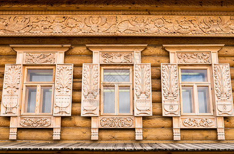 木质装饰窗口村庄财产木材镂空乡村雕刻日志窗户住宅房子背景图片