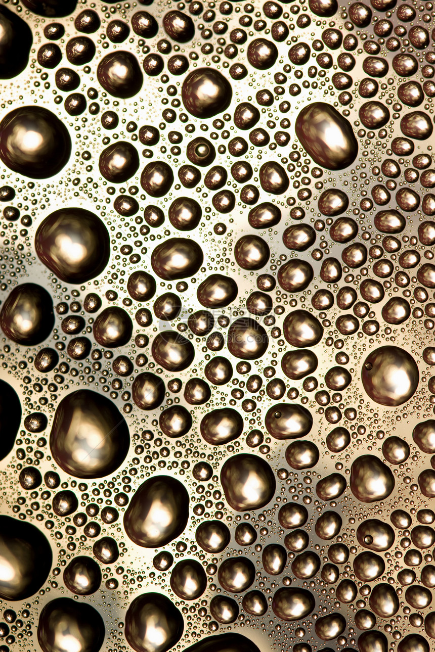 抽象水滴本底圆圈窗户雨滴环境宏观玻璃金子气泡流动瓶子图片