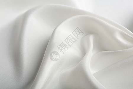 抽象白色丝绸背景材料投标组织布料生产折叠纺织品衣服曲线奢华背景图片