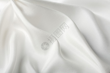 抽象白色丝绸背景生产折叠材料曲线奢华投标版税衣服织物纺织品背景图片