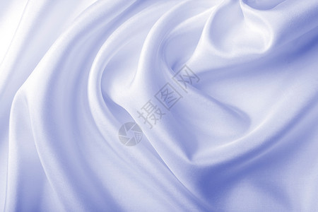 抽象蓝色丝绸背景折叠涟漪生产衣服织物曲线组织投标版税材料背景图片