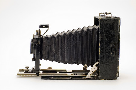 旧古典摄影机有毛皮相机历史镜片皮革机械摄影师白色收藏品吼叫格式背景图片