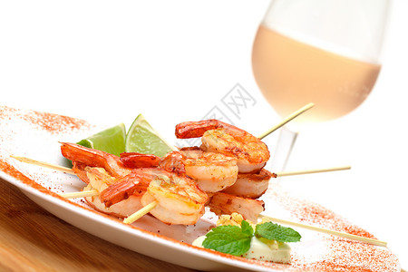 弗里德国王普瑞恩斯粉色尾巴白色玻璃海鲜食物玫瑰老虎甲壳美食背景图片