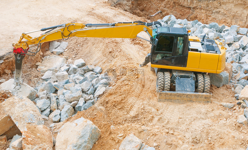 黄色挖掘器运输车辆工作工业石头机器岩石拖拉机机械挖掘机图片