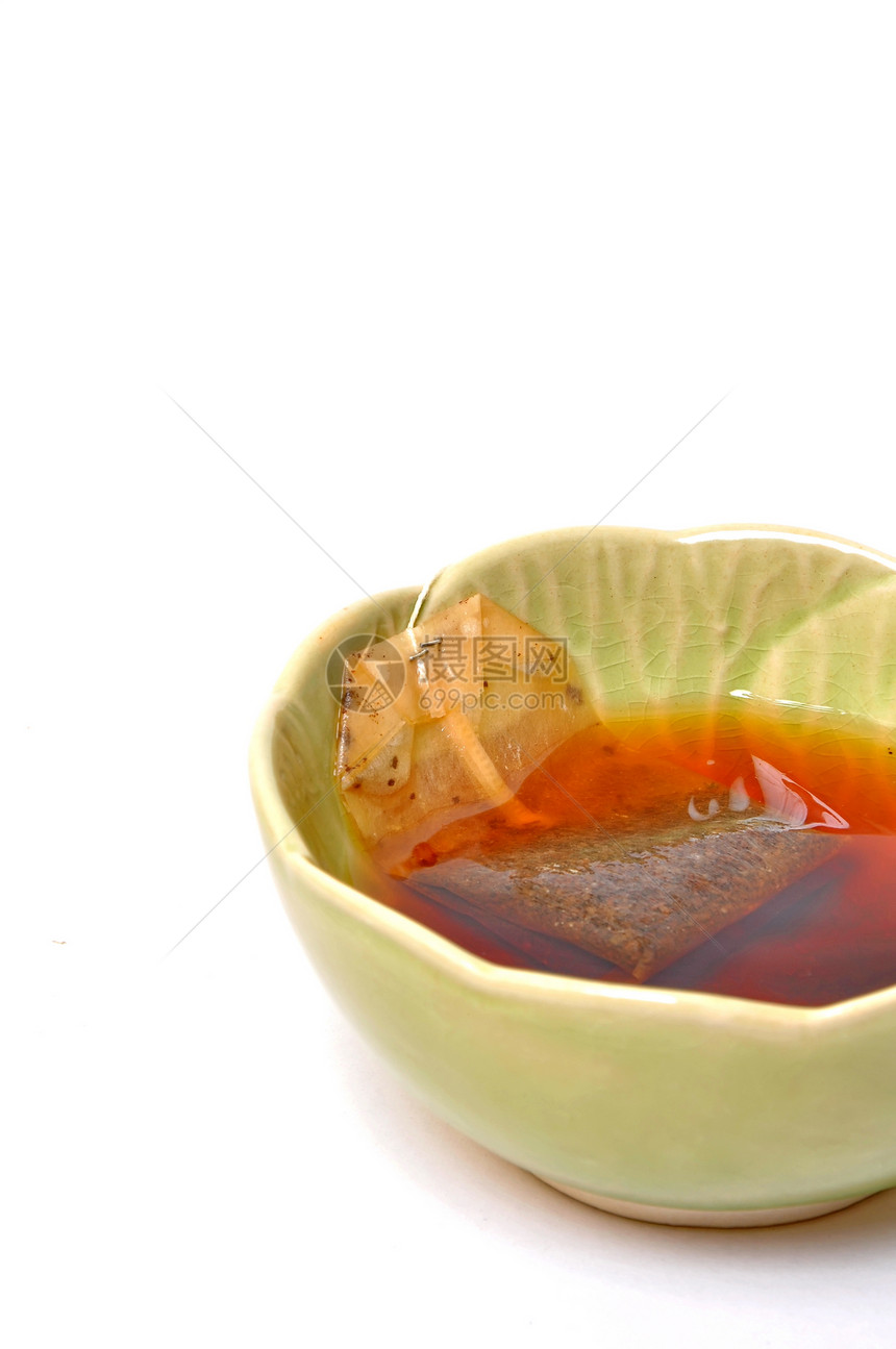 一杯茶早餐草本黑色厨房液体白色棕色草本植物餐具反射图片