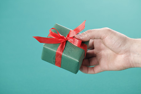 礼品红色礼物盒礼物丝带盒子庆典绿色背景图片