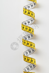 磁带测量数字黄色公制螺旋卷尺背景图片