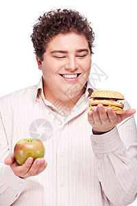 胖胖吃妹胖胖男人拿着苹果和汉堡包晚餐美食饥饿脂肪烧烤小吃食欲午餐重量男生背景