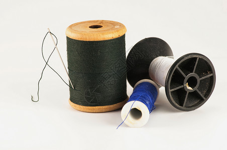针线的细线细绳筒管衣服乐器手工刺绣宏观木头工艺补给品背景图片