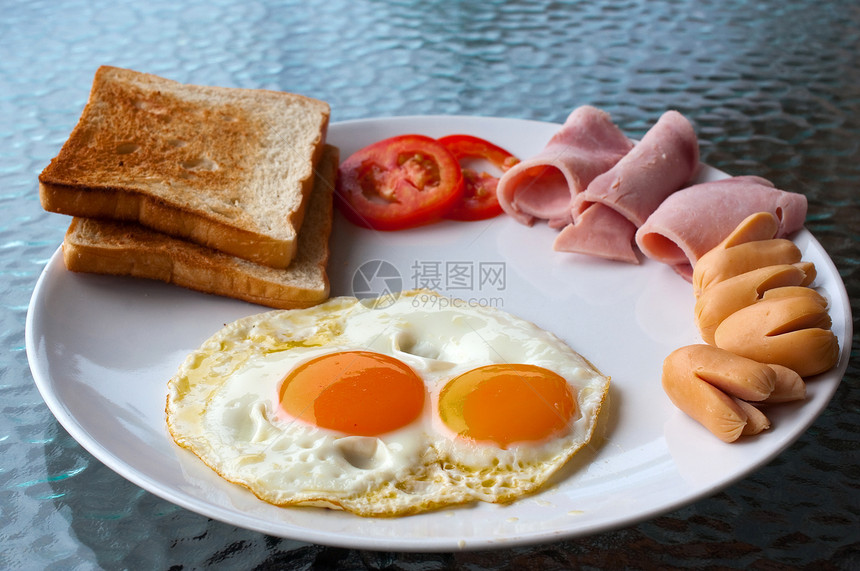 早餐产品浆果黄油面包饮料橙子香肠勺子食物盘子图片