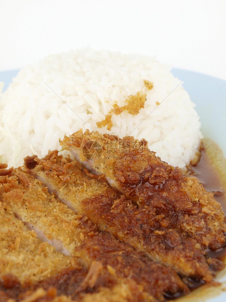 大米和炒猪肉餐厅烹饪盘子油炸食物美食筷子午餐白色图片