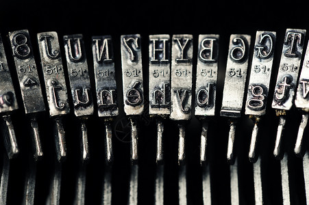 旧式打字机办公室古董复古文档风格黑色意象机器写作背景图片