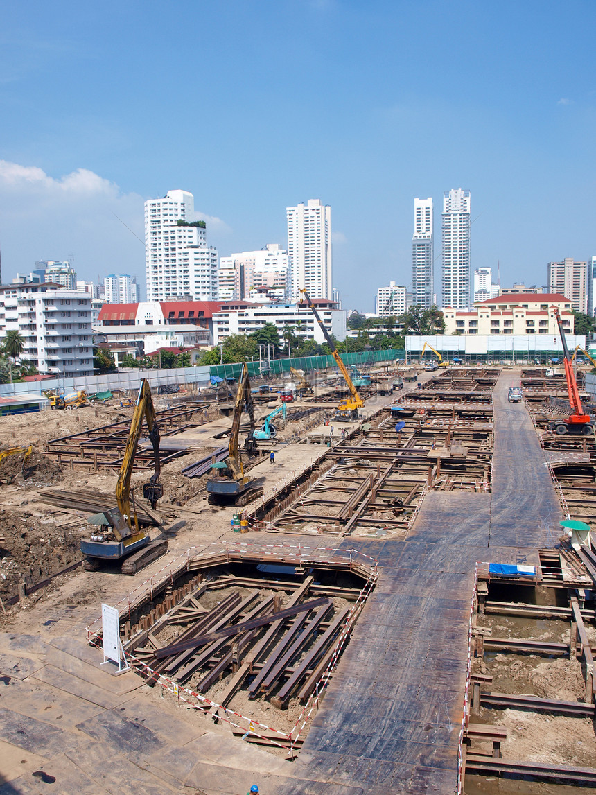 现代建筑的建造工地工程起重机挑战天空蓝色建筑学晴天图片