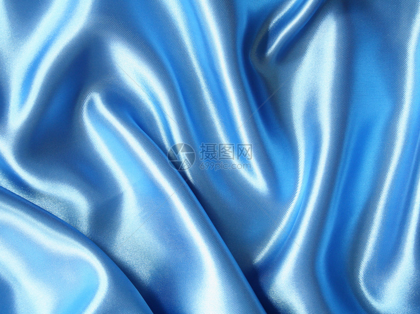 平滑优雅的深蓝丝绸可用作背景海浪银色折痕曲线织物投标材料纺织品丝绸布料图片