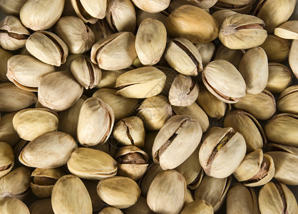 Pistachios 螺旋藻盐渍开心果产品坚果食物背景图片