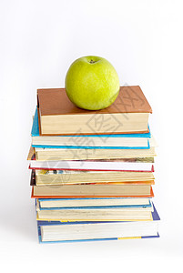 绿色苹果和书本背景图片