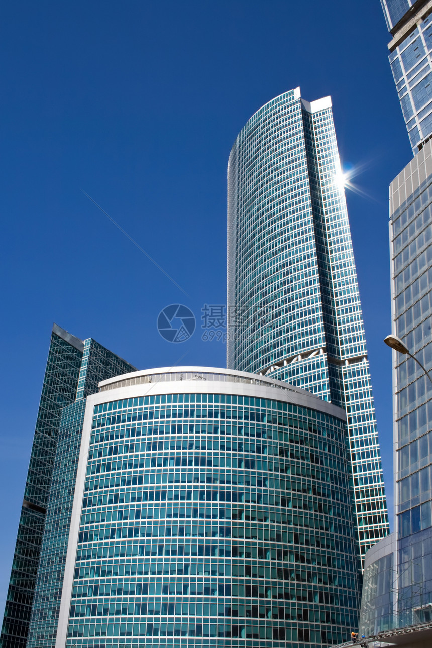 高级商务摩天大楼玻璃市中心财产晴天蓝色建筑学总部太阳城市建筑图片