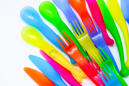 塑料餐具黄色野餐自助餐商品粉色橙子勺子餐饮绿色工具背景图片
