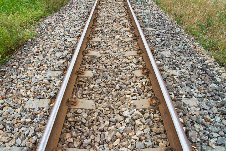 铁路过境旅行通勤者石头乘客平台引擎速度火车金属图片