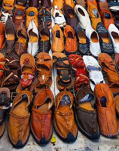 市场女士鞋鞋子在突尼斯街上出售背景