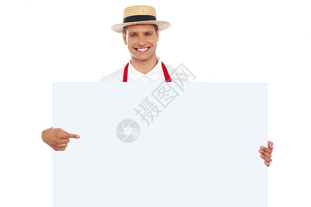 欢乐的厨师肖像 指着标牌男性营销食物围裙男人工作面包师餐饮广告牌商业背景图片