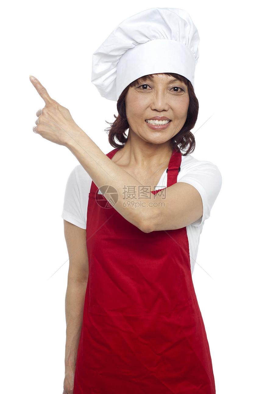 穿制服的女厨师指向方向 复制空间概念图片