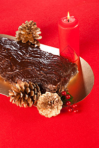 法国蛋糕海绵庆典甜点美食蜡烛装饰日志巧克力涂层背景图片