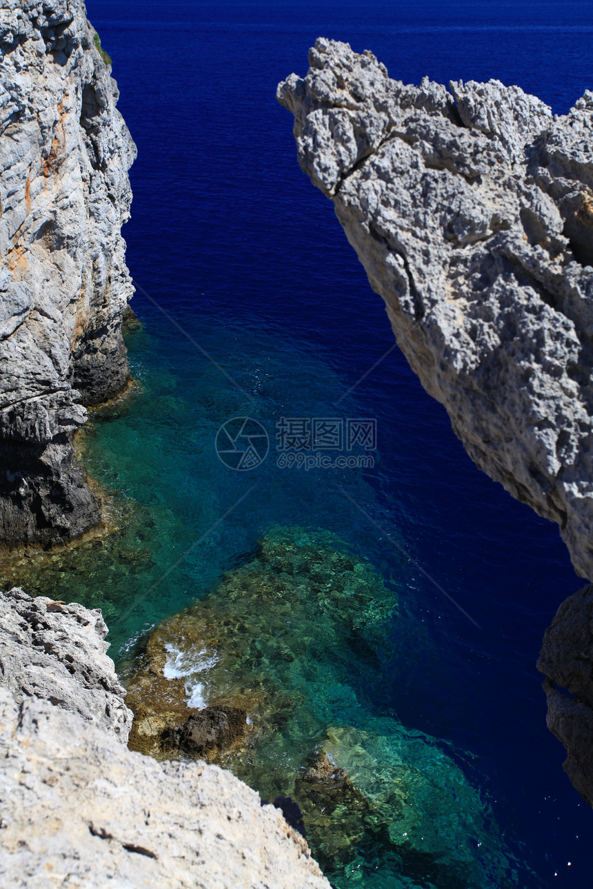 希腊岩石海岸线蓝色支撑天空绿色海景水晶旅游海滩图片