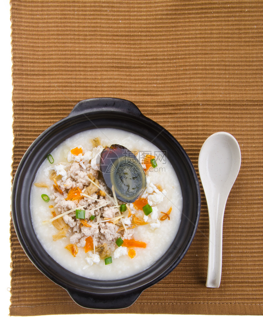 传统的中华世纪鸡蛋和猪肉粥炒饭盘子美食饮食食物猪肉勺子烹饪鸭蛋稀饭鸭子图片