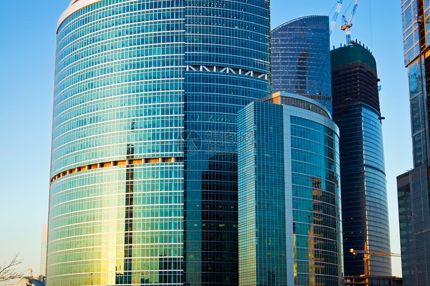 现代办公大楼商业窗户总部中心办公室玻璃日落太阳财产城市图片