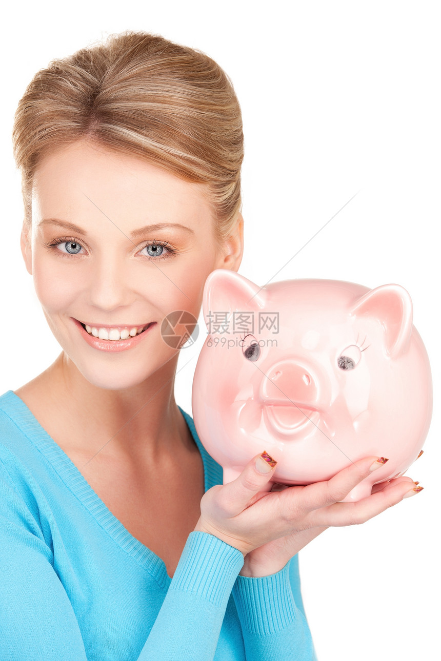 可爱的有小猪银行的女人成人蓝色金发女郎微笑幸福银行小猪女性经济女孩图片