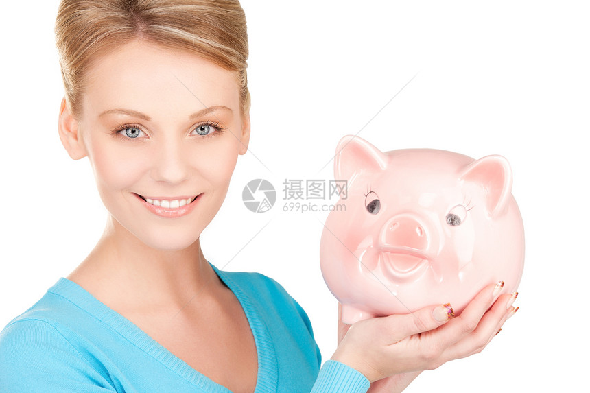 可爱的有小猪银行的女人金发女郎女孩经济成人投资财政蓝色女性金融快乐图片
