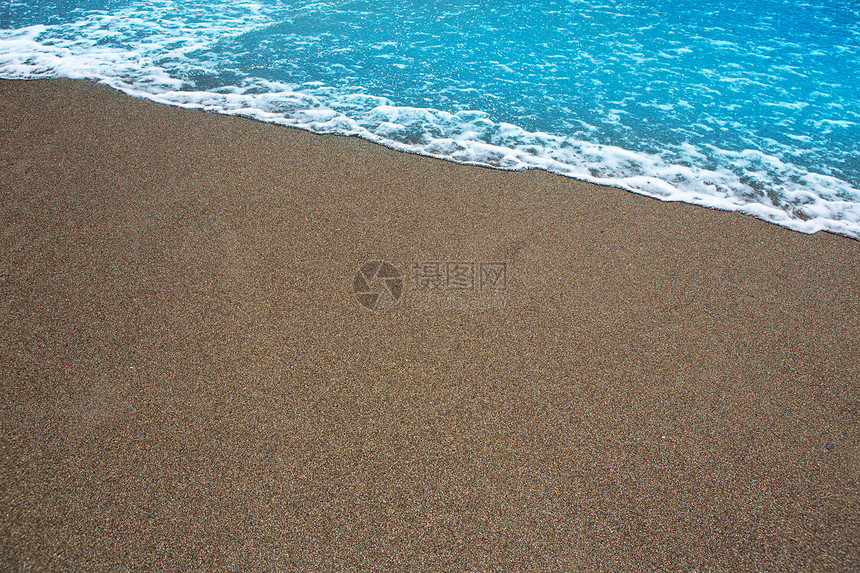 热带海滩热带 有棕色沙沙和清水海景砂砾支撑景点沙漠海浪海岸海洋异国土地图片