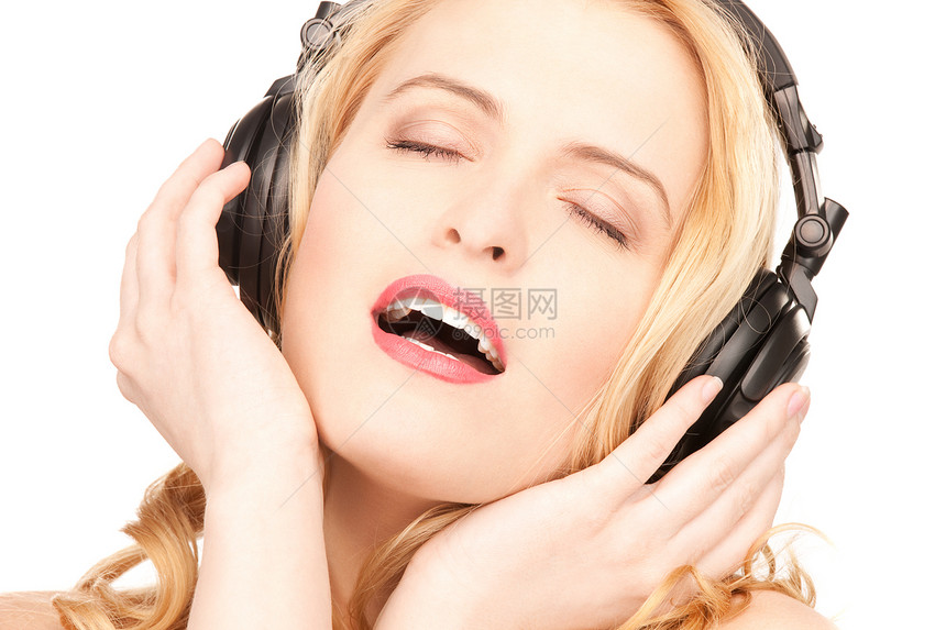 在耳机中快乐的女人幸福播音员宝贝快乐女性享受女孩立体声乐趣成人图片