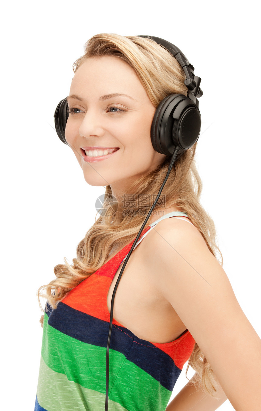 使用大耳机的快乐少女青少年手机听力音乐女孩音乐播放器乐趣享受幸福喜悦图片